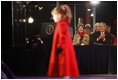 President George W. Bush and Mrs. Laura Bush watch four-year-old singer Kaitlyn Maher perform at the Pageant of Peace on the Ellipse Thursday, Dec. 4, 2008, prior to the lighting of the National Christmas Tree in Washington, D.C.