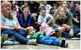 Children, their families and staff at Children's National Medical Center in Washington, D.C. watch the debut of Barney Cam VII: A Red, White & Blue Christmas, which Mrs. Laura Bush debuted Monday, Dec. 15, 2008 during her annual visit to the hospital. The crowd got to see the video about the Bush pets - dogs Barney and Miss Beazley and Willard the cat - which can be seen on the White House web site. Mrs. Bush read the book "My Penguin Osbert" to the group and visited patients.