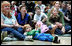 Children, their families and staff at Children's National Medical Center in Washington, D.C. watch the debut of Barney Cam VII: A Red, White & Blue Christmas, which Mrs. Laura Bush debuted Monday, Dec. 15, 2008 during her annual visit to the hospital. The crowd got to see the video about the Bush pets - dogs Barney and Miss Beazley and Willard the cat - which can be seen on the White House web site. Mrs. Bush read the book "My Penguin Osbert" to the group and visited patients.