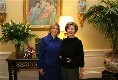 Mrs. Laura Bush poses Tuesday, Dec. 16, 2008, with Mrs. Ana Ligia Mixco Sol de Saca, wife of El Salvador's President Elias Antonio Saca, after Mrs. Saca's arrival in the Residence of the White House for a coffee.