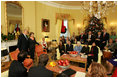 President George W. Bush and Mrs. Laura Bush stand in the Yellow Oval Room in the Private Residence of the White House Thursday, Dec. 18, 2008, after the President dropped in on a coffee in honor of the U.S. Afghan Women's Council.