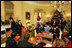 President George W. Bush and Mrs. Laura Bush stand in the Yellow Oval Room in the Private Residence of the White House Thursday, Dec. 18, 2008, after the President dropped in on a coffee in honor of the U.S. Afghan Women's Council.