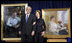 President George W. Bush and Mrs. Laura Bush stand in front of their portraits Friday, Dec. 19, 2008, after the unveiling at the Smithsonian's National Portrait Gallery in Washington, D.C. The portrait of Mrs. Bush was done by Aleksander Sasha Titovets; the Presidential portrait was done by Robert Anderson.