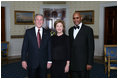 President George W. Bush and First Lady Laura Bush pose for photos with actor Avery Brooks prior to a ceremony in the East Room of the White House honoring Abraham Lincoln's 199th Birthday, Sunday, Feb. 10, 2008.