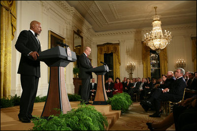 President George W. Bush and First Lady Laura Bush listen as Actor Avery Brooks, (L), and Dr. Allen Guelzo make remarks during a ceremony in the East Room of the White House honoring Abraham Lincoln's 199th Birthday, Sunday, Feb. 10, 2008.