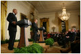 President George W. Bush and First Lady Laura Bush listen as Actor Avery Brooks, (L), and Dr. Allen Guelzo make remarks during a ceremony in the East Room of the White House honoring Abraham Lincoln's 199th Birthday, Sunday, Feb. 10, 2008.