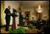 President George W. Bush and First Lady Laura Bush listen as Actor Avery Brooks, (L), and Dr. Allen Guelzo make remarks during a ceremony in the East Room of the White House honoring Abraham Lincoln's 199th Birthday, Sunday, Feb. 10, 2008.