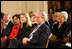 President George W. Bush, Mrs. Laura Bush, Jenna Bush and Secretary of State Condoleezza Rice join the East Room audience in listening to The Temptations Tuesday, Feb. 12, 2008, during a celebration of African American History Month.