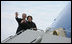 President George W. Bush and Mrs. Laura Bush wave from Air Force One as they board the aircraft Friday, Feb. 16, 2008, at Andrews Air Force Base en route to Benin, the first stop on their five-country, African visit.