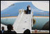 President George W. Bush and Mrs. Laura Bush wave to President Boni Yayi of Benin and Madame Chantal de Souza Yayi as they board Air Force One Saturday, Feb. 16, 2008, after visiting the African country on the first leg of their five-country trip. The President and Mrs. Bush later arrived in Tanzania, where they will spend two days.