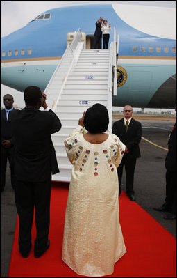 President George W. Bush and Mrs. Laura Bush wave to President Boni Yayi of Benin and Madame Chantal de Souza Yayi as they board Air Force One Saturday, Feb. 16, 2008, after visiting the African country on the first leg of their five-country trip. The President and Mrs. Bush later arrived in Tanzania, where they will spend two days.