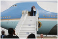 President George W. Bush and Mrs. Laura Bush wave to President Boni Yayi of Benin and Madame Chantal de Souza Yayi as they board Air Force One Saturday, Feb. 16, 2008, after visiting the African country on the first leg of their five-country trip. The President and Mrs. Bush later arrived in Tanzania, where they will spend two days.