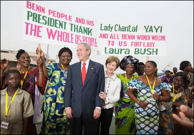 President George W. Bush and Mrs. Laura Bush pose with women at Cadjehoun International Airport in Cotonou, Benin Saturday, Feb. 16, 2008, after they greeted the President and First Lady upon arrival.