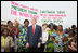 President George W. Bush and Mrs. Laura Bush pose with women at Cadjehoun International Airport in Cotonou, Benin Saturday, Feb. 16, 2008, after they greeted the President and First Lady upon arrival.