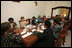 Mrs. Laura Bush participates in a roundtable discussion with faith-based HIV/AIDS Prevention Program graduates Sunday, Feb. 17, 2008, at Karimjee Hall in Dar es Salaam, Tanzania. Mrs. Bush reconfirmed America’s commitment to the Tanzanian people and their continued efforts against HIV/AIDS. At left is Mrs. Salma Kikwete, First Lady of Tanzania.