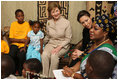 Mrs. Laura Bush joins a discussion with orphans and caretakers at the WAMA Foundation Sunday, Fab. 17, 2008 in Dar es Salaam, Tanzania, during a meeting to launch the National Plan of Action for Orphans and Vulnerable Children.