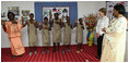 Mrs. Laura Bush and Madame Chantal de Souza Yayi, wife of President Boni Yayi, enjoy a performance by recipients of the Ambassador's Girls Scholarship during a visit Saturday, Feb. 16, 2008, by President George W. Bush and Mrs. Bush to Benin.