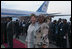 Mrs. Laura Bush and Salma Kikwete, wife of President Jakaya Kikwete of Tanzania, stand on the red carpet Saturday, Feb. 16, 2008, after the arrival of President George W. Bush and Mrs. Bush to Julius Nyerere International Airport in Dar es Salaam.