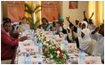 Mrs. Laura Bush and Mrs. Salma Kikwete sit at the head of the table during a roundtable Sunday, Feb. 17, 2008, in Dar es Salaam, with Madrasa graduates who have received HIV prevention education as part of their religious instruction. Madrasa training is comparable to the training students in the U.S. receive in Sunday school or Hebrew school.