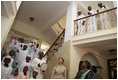 Mrs. Laura Bush and Mrs. Salma Kikwete acknowledge the performance of the Madrasa Salima Choir as they depart Karimjee Hall Sunday, Feb. 17, 2008, after participating in a roundtable discussion on HIV/AIDS.