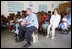 President George W. Bush and Mrs. Laura Bush join children and their families during a welcoming program Monday, Feb. 18, 2008, at the Maasai Girls School in Arusha, Tanzania.