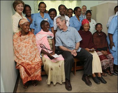 President George W. Bush and Mrs. Laura Bush pose for a photo Monday, Feb. 18, 2008, with patients and staff at the Meru District Hospital outpatient clinic in Arusha, Tanzania.