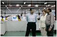 Mrs. Laura Bush speaks with the management representatives of A to Z Textiles Monday, Feb. 18, 2008, in Arusha, Tanzania, where workers stitch mosquito nets in the fight against malaria.