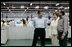 Mrs. Laura Bush speaks with the management representatives of A to Z Textiles Monday, Feb. 18, 2008, in Arusha, Tanzania, where workers stitch mosquito nets in the fight against malaria.