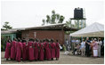 President George W. Bush and Mrs. Laura Bush applaud a dance performance Monday, Feb. 18, 2008, at the Maasai Girls School in Arusha, Tanzania.