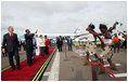 President George W. Bush and President Jakaya Kikwete of Tanzania are joined by Salma Kikwete, spouse of President Jakaya Kikwete, and Mrs Laura Bush as they watch a cultural performance Tuesday, Feb. 19, 2008, at the Julius Nyerere International Airport in Dar es Salaam, Tanzania before their departure to Kigali, Rwanda.