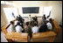 President George W. Bush and Mrs. Laura Bush visit Tuesday, Feb. 19, 2008, with participants who have completed the parent-child communication program, during a meeting at the Lycee de Kigali in Kigali, Rwanda.