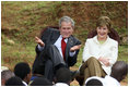 President George W. Bush and Mrs. Laura Bush react during a discussion with members of the Lycee de Kigali 'Anti-AIDS Club' Tuesday, Feb. 19, 2008, outside of the Lycee de Kigali in Kigali, Rwanda.