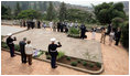 President George W. Bush and Mrs. Laura Bush pause for a moment of silence after laying a wreath on a mass grave at the genocide memorial Tuesday, Feb. 19, 2008, at the Kigali Memorial Centre in Kigali, Rwanda.