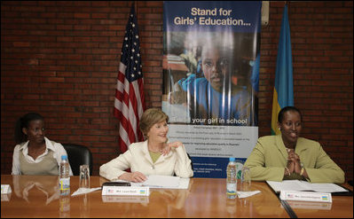 Mrs. Laura Bush joins Rwanda first lady Jeannette Kagame, right, during a forum Tuesday, Feb. 19, 2008 in Kigali, Rwanda, to promote girl's education.