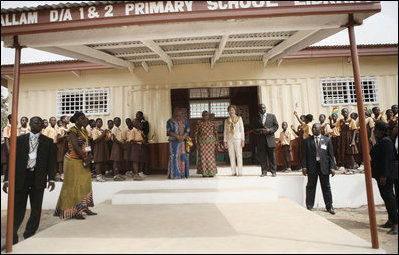 Mrs. Laura Bush and Ghana first lady Mrs. Theresa Kufuor are greeted by students and school officials on their arrival to Mallam D/A Primary School, Wednesday, Feb. 20, 2008 in Accra, Ghana.