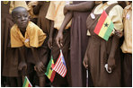 A young student at the Mallam D/A Primary School in Accra, Ghana, watches for the arrival of Mrs. Laura Bush and Ghana first lady Theresa Kufuor, Wednesday, Feb. 20, 2008 in Accra, Ghana.