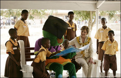 Mrs. Laura Bush participates in a reading lesson with students in their "reading hut" with the school’s reading mascot Wednesday, Feb. 20, 2008, at the Mallam D/A/ Primary School in Accra, Ghana.