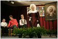 Ms. Mary Wiseman, Martha Washington Re-enactor, Mount Vernon Estate and Gardens, leads Mrs. Laura Bush, Santiago Echeverria, Student, and Dr. Tish Howard, Principal, Washington Mill Elementary School, in a ceremony at Washington Mill Elementary School Tuesday, January 15, 2008, in Alexandria, Virginia, to celebrate Mount Vernon's "George Washington's Return to School" program. The "Portrait of Leadership" initiative was planned to coincide with the 275th birthday year of George Washington, celebrated in February of 2007, to help put a portrait of George Washington in class rooms in all fifty states.