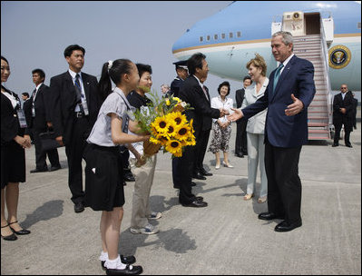 President George W. Bush and Laura Bush are welcomed on their arrival Sunday, July 6, 2008 to the New Chitose International Airport, to attend the Group of Eight Summit in Toyako, Japan.