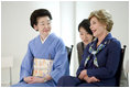 Mrs. Laura Bush smiles as she joins Mrs. Kiyoko Fukuda, left, spouse of Japan's Prime Minister Yasuo Fukuda, and other G-8 spouses at a traditional Japanese cultural program Monday, July 7, 2008, at the Windsor Hotel Toya Resort and Spa in Toyako, Japan.