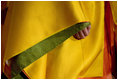 The hand of a model is barely seen under her layered sleeve during a demonstration Monday, July 7, 2008, of Junihitoe, 12-layered Ancient Kimono, for the G-8 spouses in Toyako, Japan. Junihitoe means 12 layers and is an example of the formal court dress worn by women during the Heian period (790-1185). Women were hidden behind screens at court and an occasional glimpse of their layered sleeves and hems was all that would be visible to a visitor or a suitor.