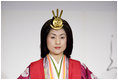 A young woman models a Junihitoe, a 12-layered formal court dress worn by women during the Heian period, during a demonstration of traditional Japanese culture Monday for G-8 spouses at the Windsor Hotel Toya Resort and Spa in Toyako, Japan.