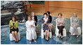 Mrs. Bush participates in a discussion with Junior 8 (J8) members and other G-8 spouses during her visit to the Toyako Town Visitors Center Wednesday, July 9, 2008, in Hokkaido, Japan. Mrs. Bush is joined by from left, Mrs. Sarah Brown, spouse of the Prime Minister of the United Kingdom, Mrs. Svetlana Medvedev, spouse of the President of Russia, Mrs. Kiyoko Fukuda, spouse of the Prime Minister of Japan, and Mrs. Laureen Harper, spouse of the Prime Minister of Canada.