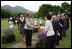 Mrs. Laura Bush, accompanied by Mrs. Kiyoko Fukuda, spouse of the Prime Minister of Japan, left, is greeted as she arrives to the Toyako New Mount Showa Memorial Park for a ceremonial tree planting ceremony with other G-8 spouses Wednesday, July 9, 2008, in Hokkaido, Japan. 