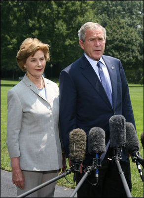 President George W. Bush and Mrs. Laura Bush meet with reporters Sunday, July 13, 2008 upon their arrival back to the White House, to express their sadness on the death of former White House Press Secretary Tony Snow.