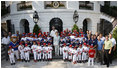 President George W. Bush and Mrs. Laura Bush stand with the All-Star Tee Ball teams and participants on the South Portico Wednesday, July 16, 2008, following a double-header at the White House with pitting Eastern U.S. against Central U.S. and Southern U.S. against Western U.S.