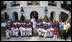 President George W. Bush and Mrs. Laura Bush stand with the All-Star Tee Ball teams and participants on the South Portico Wednesday, July 16, 2008, following a double-header at the White House with pitting Eastern U.S. against Central U.S. and Southern U.S. against Western U.S.