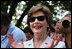 Mrs. Laura Bush shows her enthusiasm for the spirited game of tee ball as young All-Star players from across the United States gather to play on the White House South Lawn on July 16, 2008. President George W. Bush watched the game a few seats away on a bleachers set up for the event for the young players.