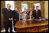 President George W. Bush signs H.J. Res. 93, the Renewal of Import Restrictions on Burma and H.R. 3890, the Tom Lantos Block Burmese JADE Act of 2008, Tuesday, July 29, 2008 in the Oval Office of the White House. President Bush was joined during the signings by, from left, Rep. Don Manzullo, R-Ill.; Rep. Chris Smith, R-N.J.; Mrs. Laura Bush, Annette Lantos, widow of Rep. Tom Lantos; Lantos grandson, Shiloh Tilleman; Rep.Rush Holt, D-N.J.; Rep. Joe Pitts, R-Pa.; and Rep. Peter King, R-N.Y.