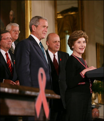 President George W. Bush is introduced to the podium by Mrs. Laura Bush Wednesday, July 30, 2008 in the East Room of the White House, prior to signing H.R. 5501, the Tom Lantos and Henry J. Hyde United States Global Leadership Against HIV/AIDS, Tuberculosis and Malaria Reauthorization Act of 2008.